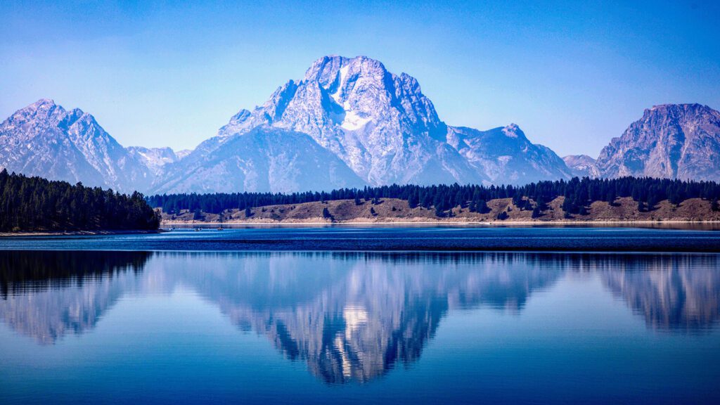 Mount Moran is reflected at Oxbow Bend in Grand Teton National Park.
