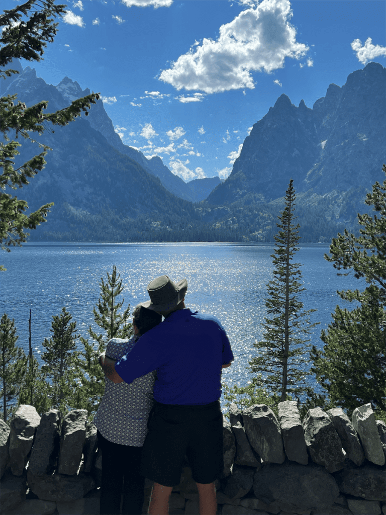 Silhouette of couple at Jenny Lake taken on a multi-day Yellowstone tour with Teton Excursions in Grand Teton National Park